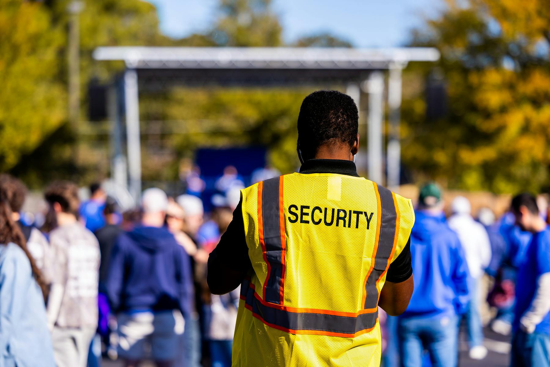 Security personnel moving through a live event environment
